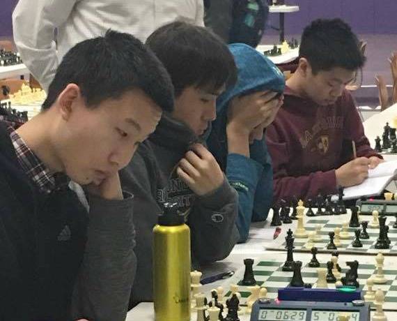From left, Sam Deng, Noah Yeo and Anshul Ahluwalia compete at the Washington state chess competition earlier in 2017. File photo