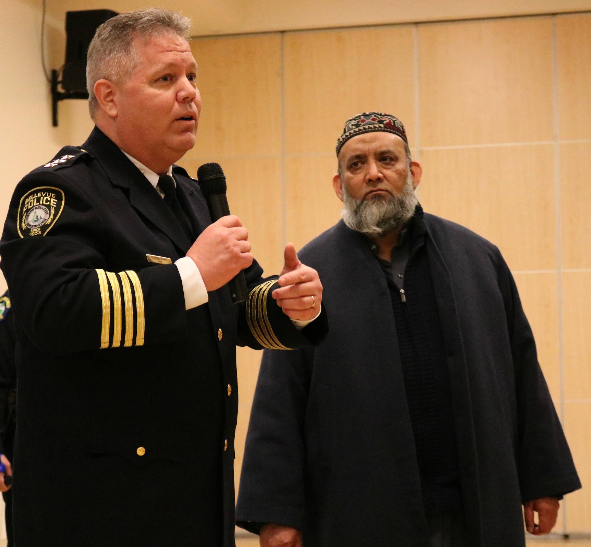 Bellevue Police Department Chief Steven Mylett interacts with Imam Sheikh Fazal of the Islamic Center of Eastside during the Eastside Muslim Safety Forum in January at the Muslim Association of Puget Sound in Redmond. Andy Nystrom, Redmond Reporter