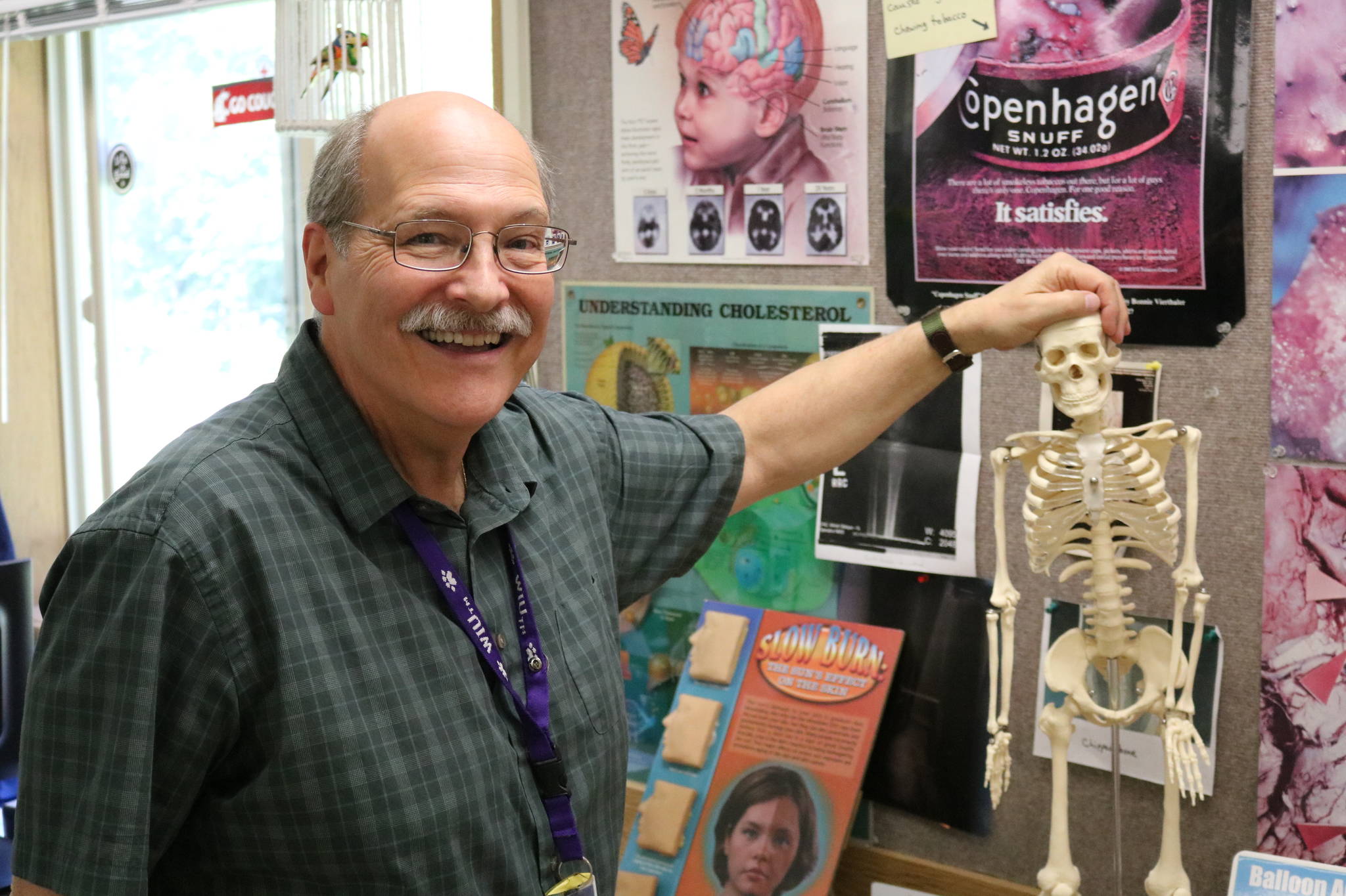 Paul Blair shows off one of his many props he uses to teach students about health at Evergreen Middle School in Redmond. He is retiring after 35 years at the school. Aaron Kunkler, Redmond Reporter