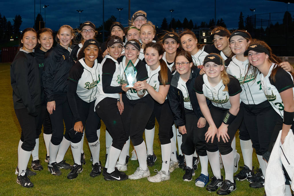 Redmond’s softballers celebrate winning their 3A SeaKing District title last night. Courtesy of Brian Kipnis