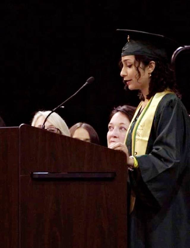 Elisa Kadackal speaks at commencement. Courtesy photo
