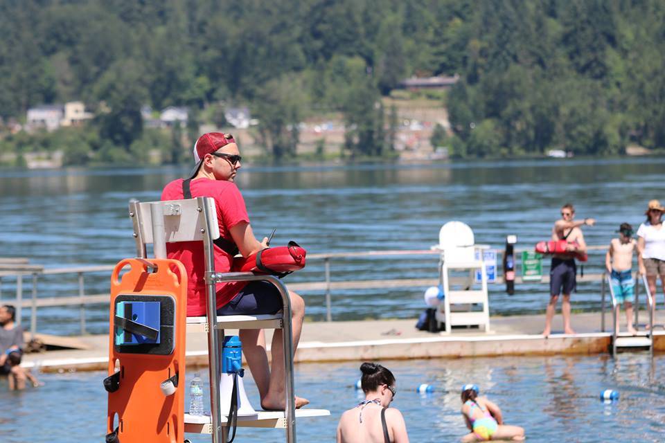 Lifeguard Andrew Oakley keeps an eye on swimmers at Idylwood Park during a recent hot summer afternoon. Aaron Kunkler/Redmond Reporter