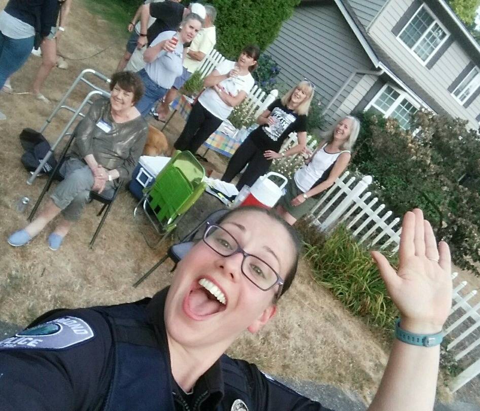 Redmond Police Department Sgt. Julie Beard snaps a selfie at a block party.