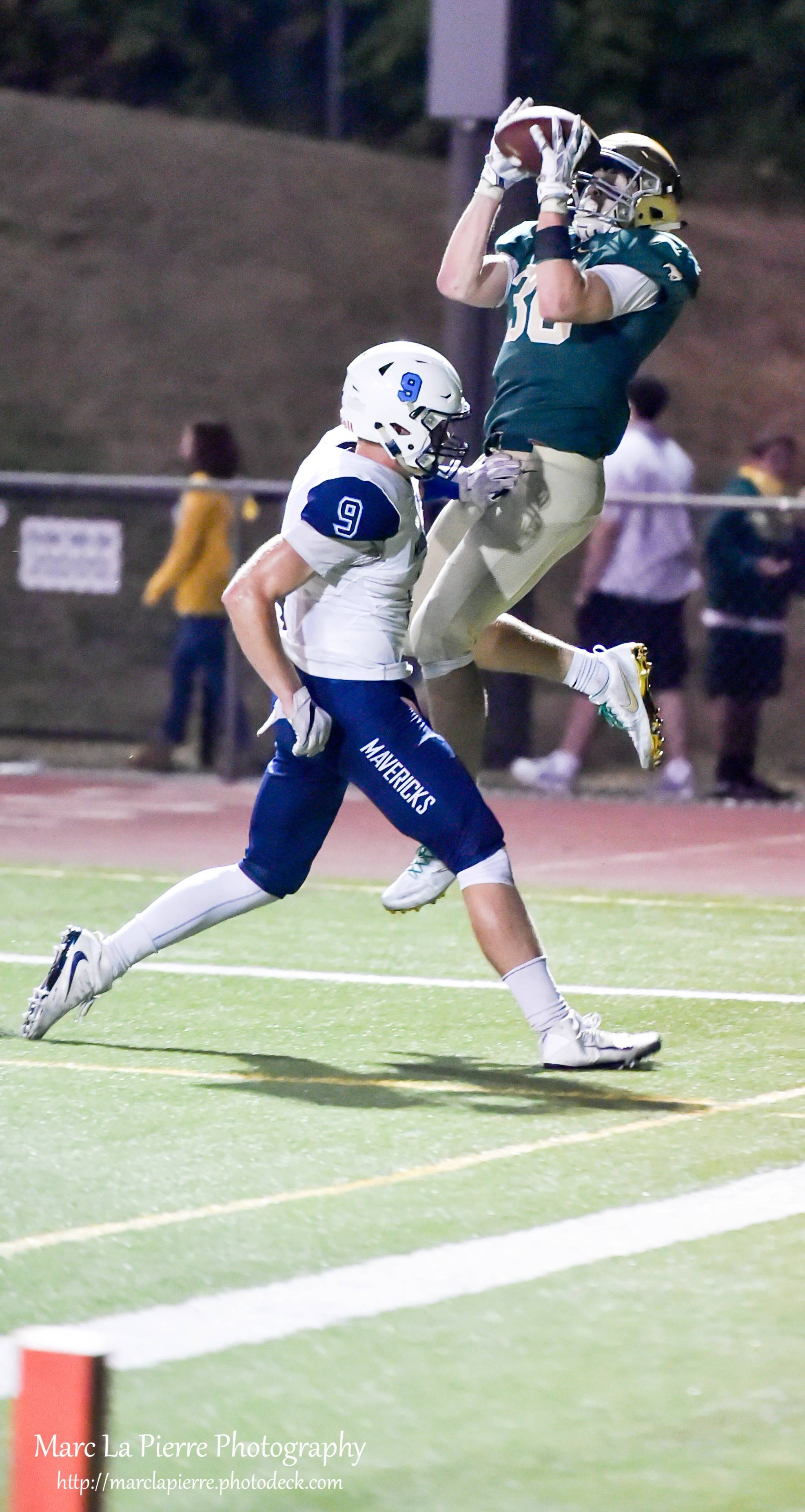 Redmond’s Carson Bruener hauls in a touchdown pass on Friday. Courtesy of Marc La Pierre Photography http://marclapierre.photodeck.com/