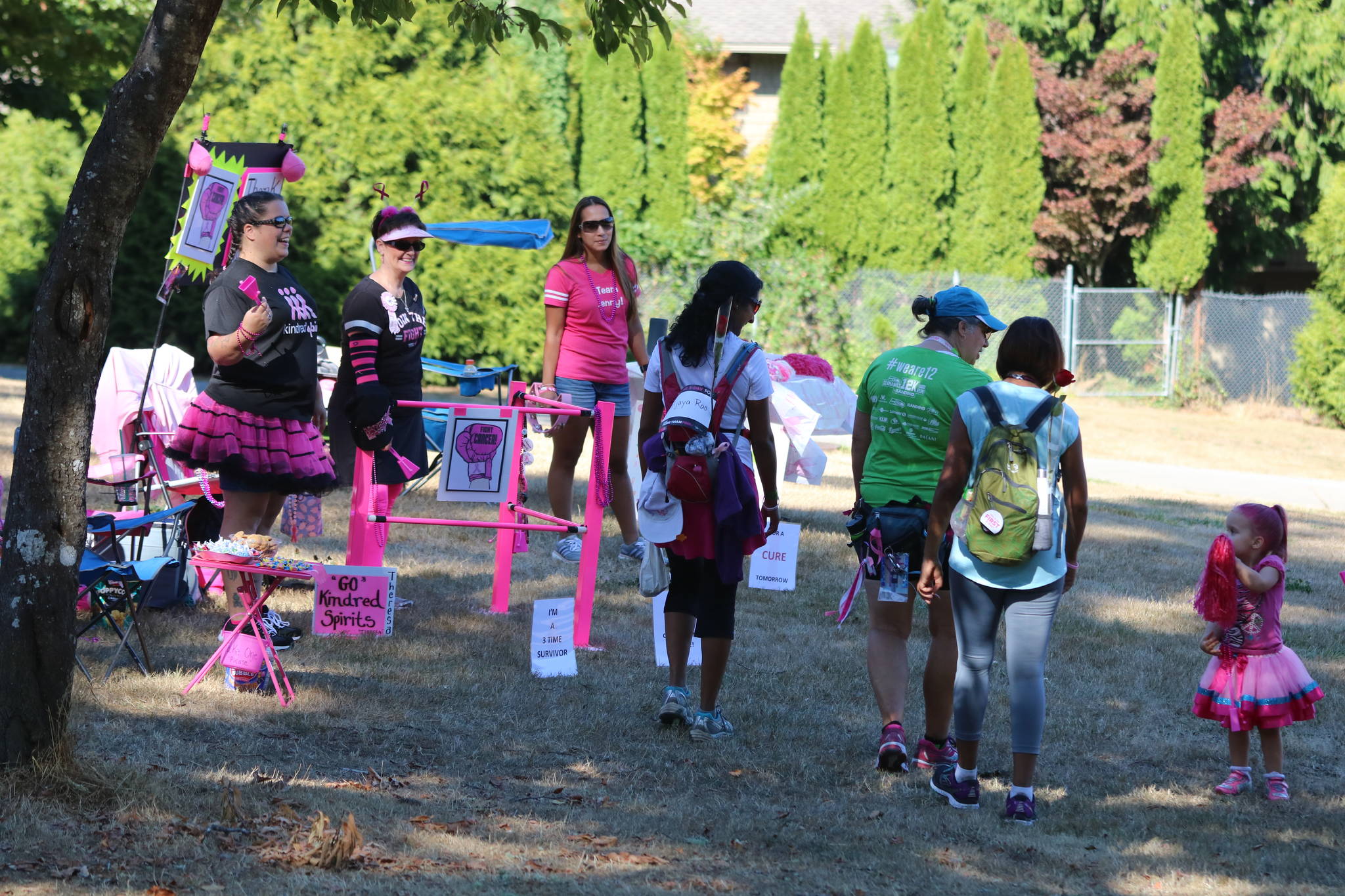 A cheering group greets Susan G. Komen 3-Day walkers Friday afternoon at Idylwood Park. The event is a fight against breast cancer. Andy Nystrom, Redmond Reporter