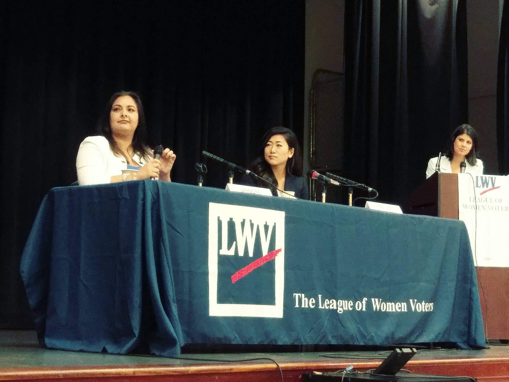 State Senate candidates Manka Dhingra, left, and Jinyoung Lee Englund, center, at Monday’s League of Women Voters debate in Redmond. Moderator Natalie Brand is on the right. Aaron Kunkler/Redmond Reporter