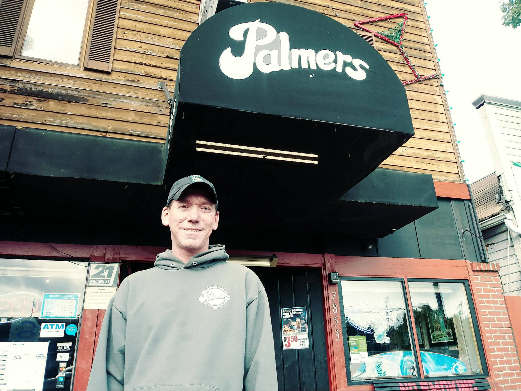 Thomas Wilhite, owner of Palmers East, stands in front of his bar on Wednesday morning. Aaron Kunkler/Redmond Reporter