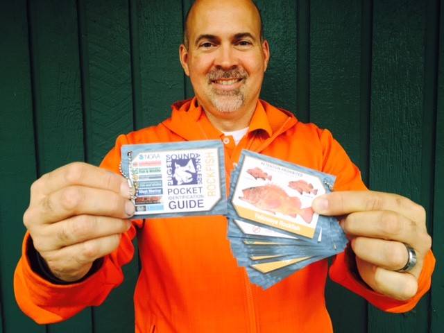 J.D. Klein of Minuteman Press with the Rockfish Pocket Identification Guide. Courtesy photo
