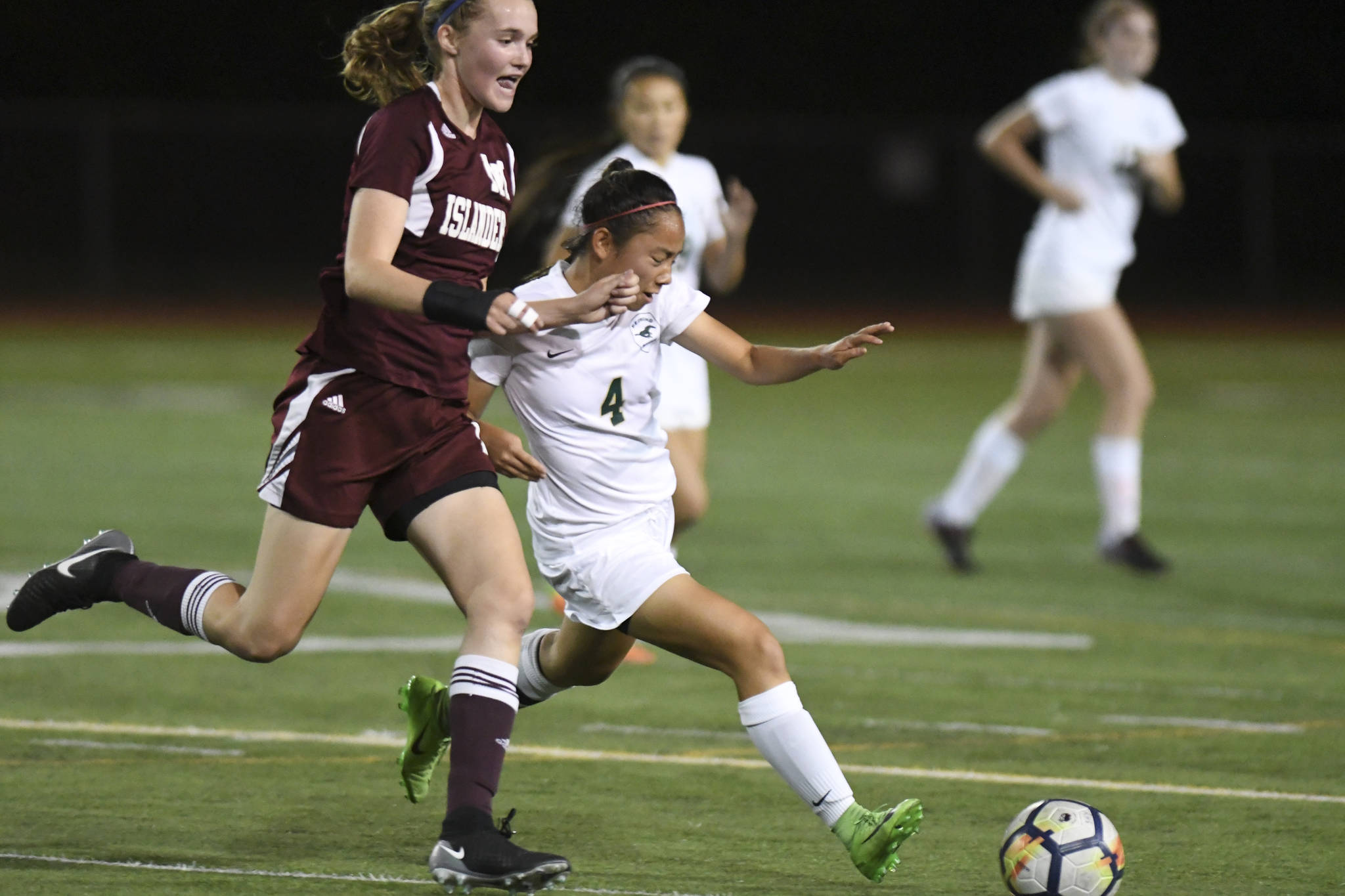 Redmond’s Andrea Dang, right, battles for the ball with Mercer Island’s Kendall Riley. Courtesy of Dale Garvey