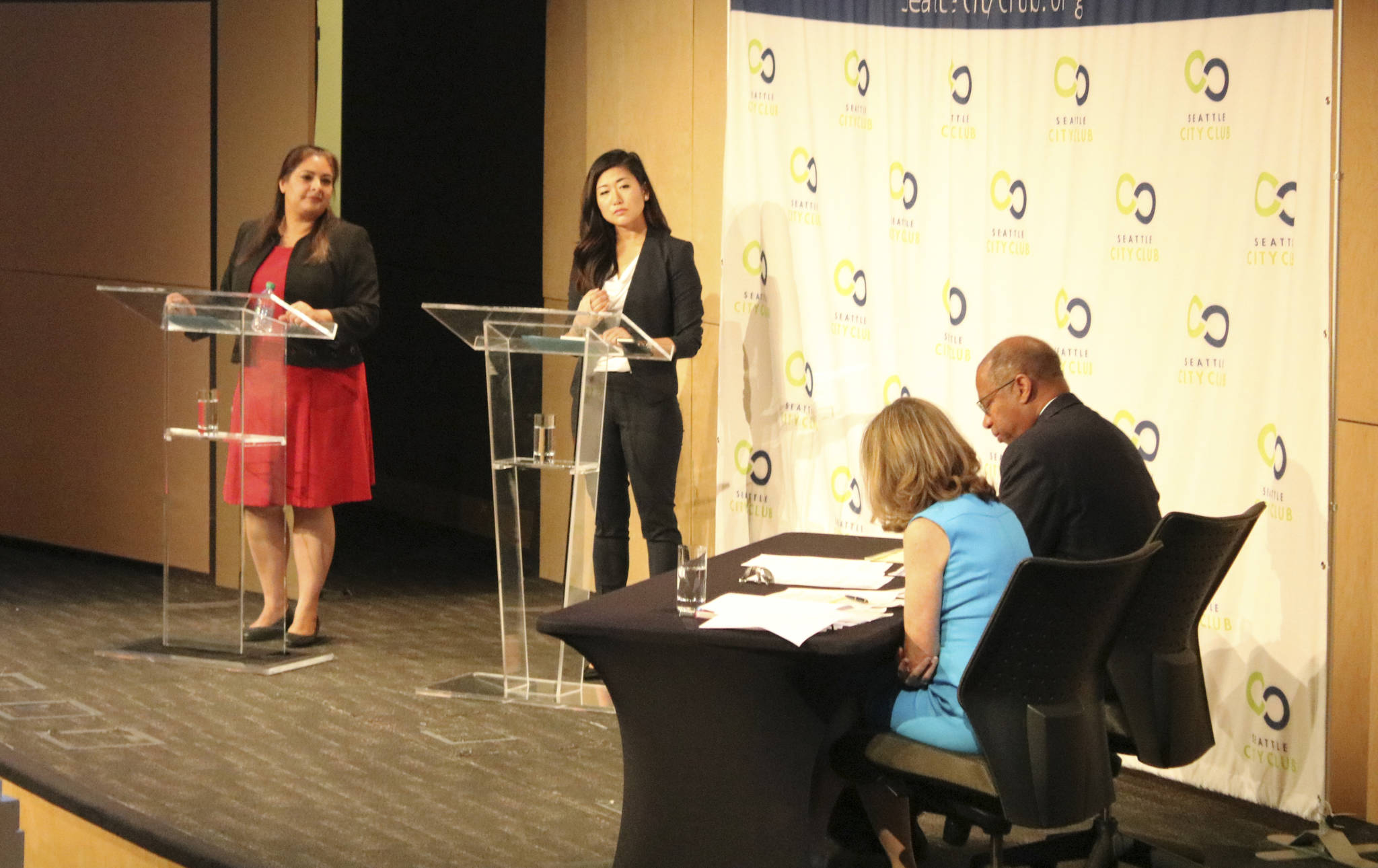 Manka Dhingra, left, and Jinyoung Lee Englund, center left, squar off at a debate on the Microsoft campus on Tuesday. At right are KIRO 7 moderators. Aaron Kunkler/Redmond Reporter