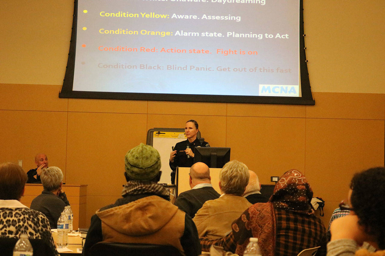 Issaquah Police Commander Paula Schwan discusses personal safety and de-escalation of threats. Nicole Jennings/staff photo