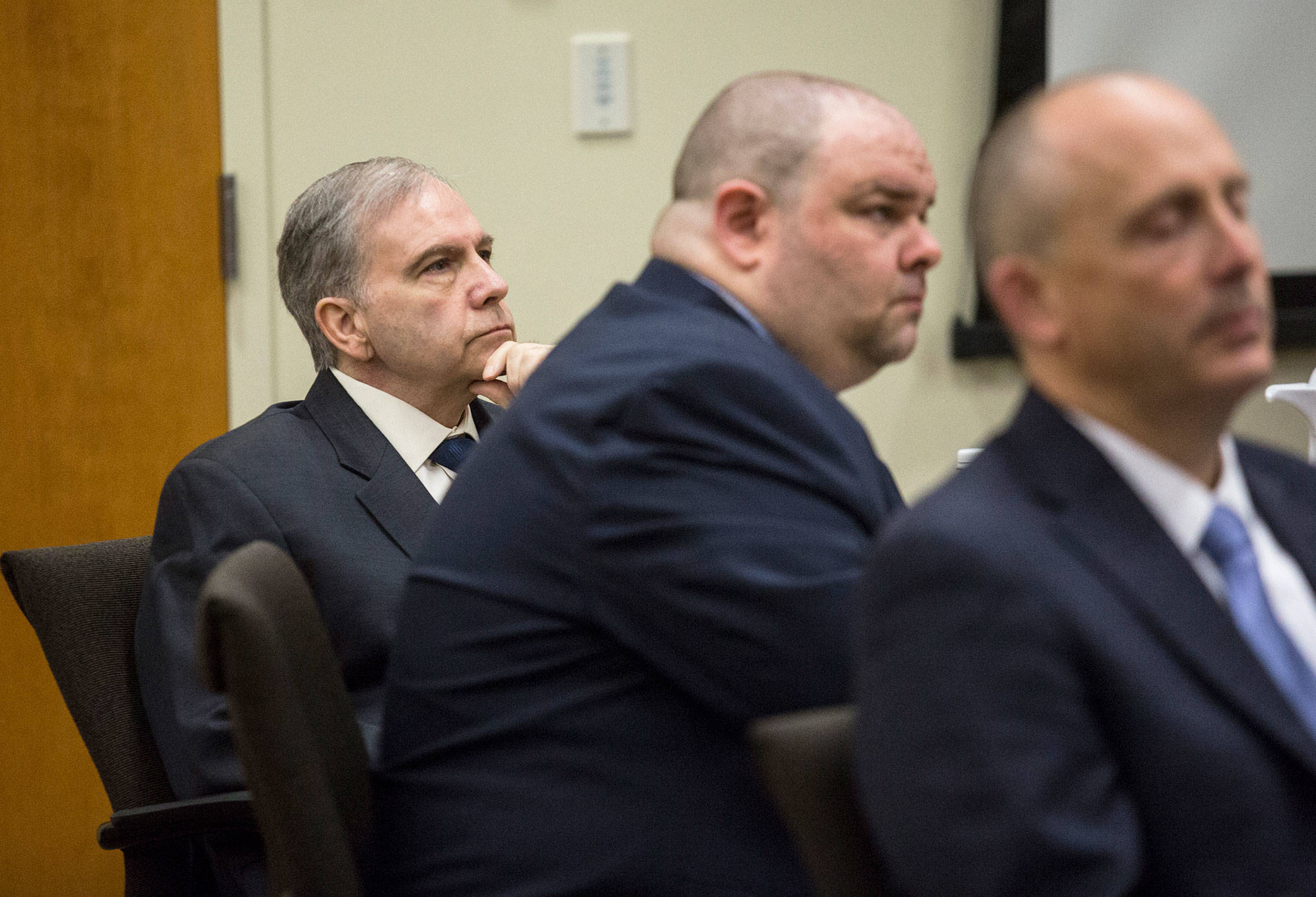 John Blaine Reed (left) accused of murdering Monique Patenaude and Patrick Shunn, listens as Snohomish County chief criminal deputy prosecutor Craig Matheson makes opening statements in his trial at the Snohomish County Courthouse on Thursday in Everett. (Andy Bronson / The Herald)