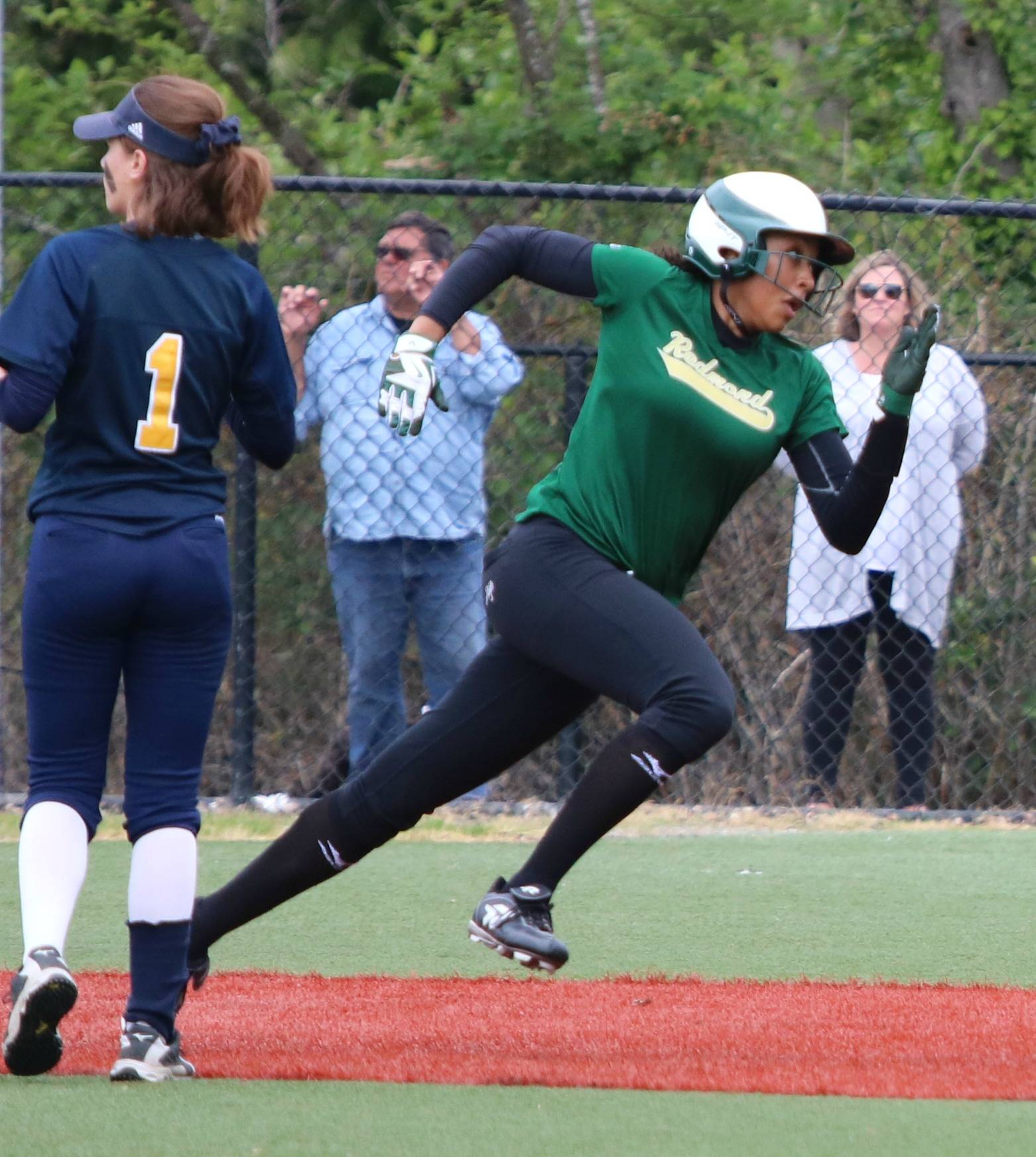 Kiki Milloy on her way to a triple. Andy Nystrom / staff photo