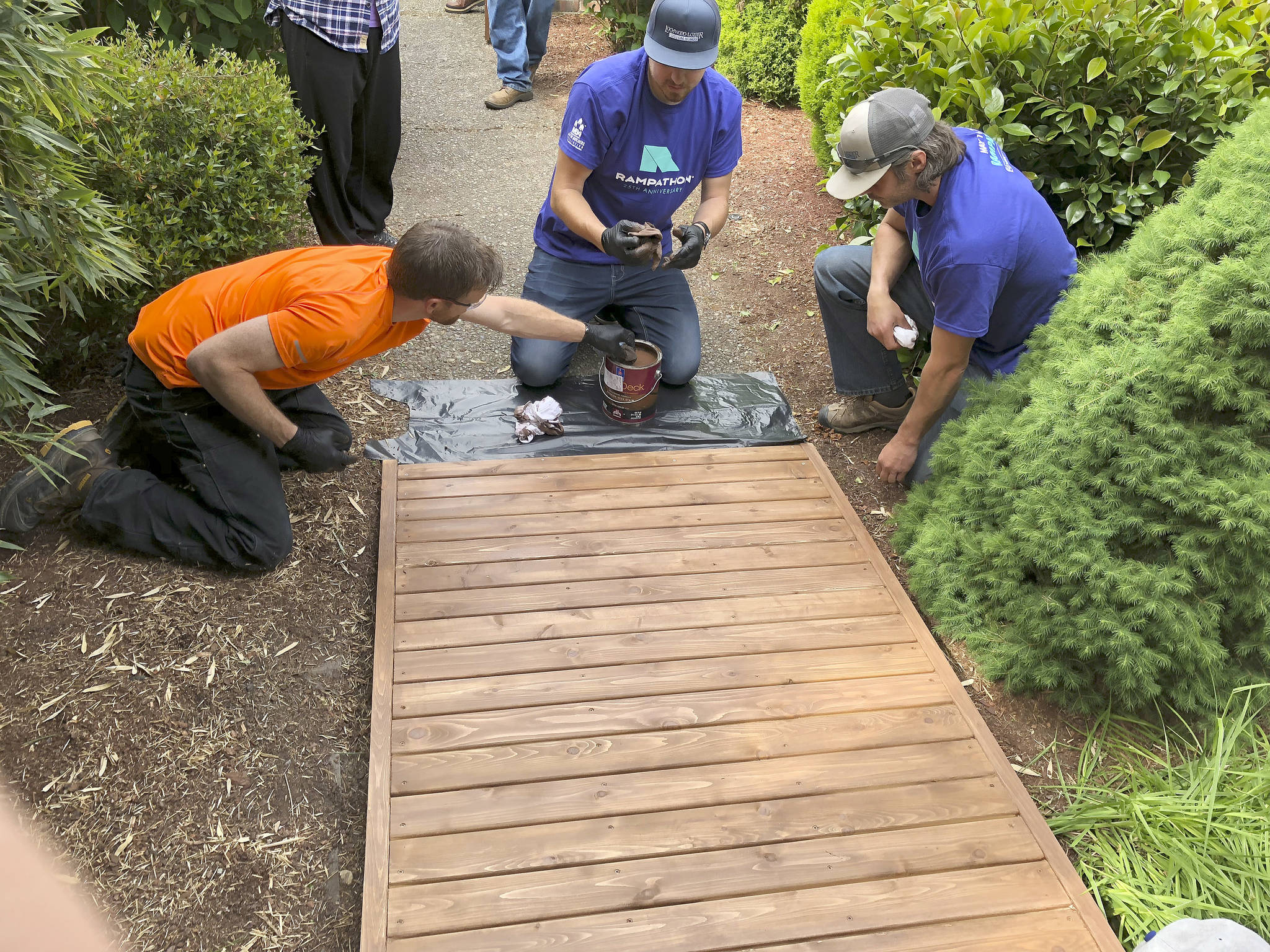 Volunteers build access ramps for locals