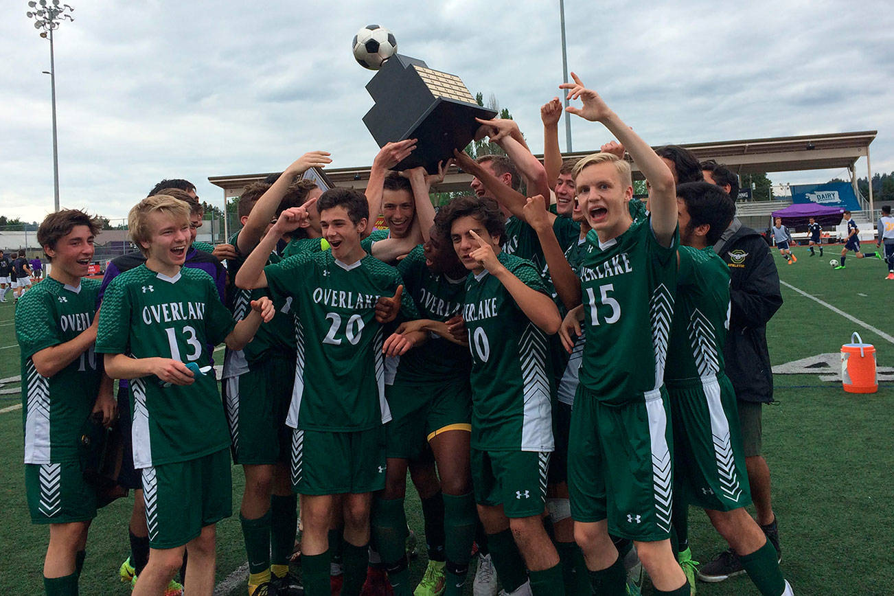 Shaun Scott, staff photo                                The Overlake Owls boys soccer team hoists the state championship trophy following their convincing 3-0 victory against the Wahluke Warriors in the Class 1A state soccer championship game on May 26 at Sunset Chev Stadium in Sumner.