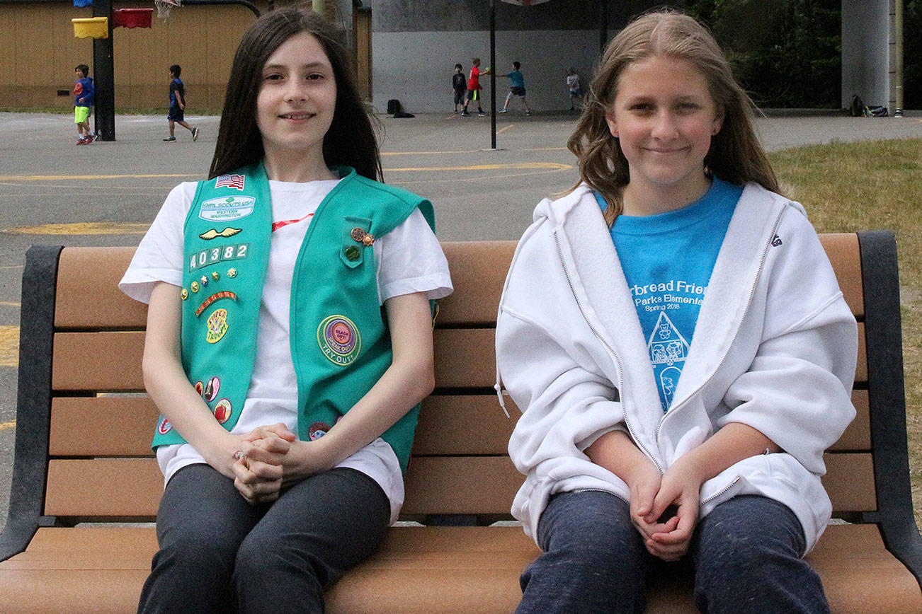Rosa Parks Elementary fifth graders, Miriam Terdina and Ellie Hagen donated 20 hours to provide a buddy bench for students. Photo by Madison Miller/Staff Photo