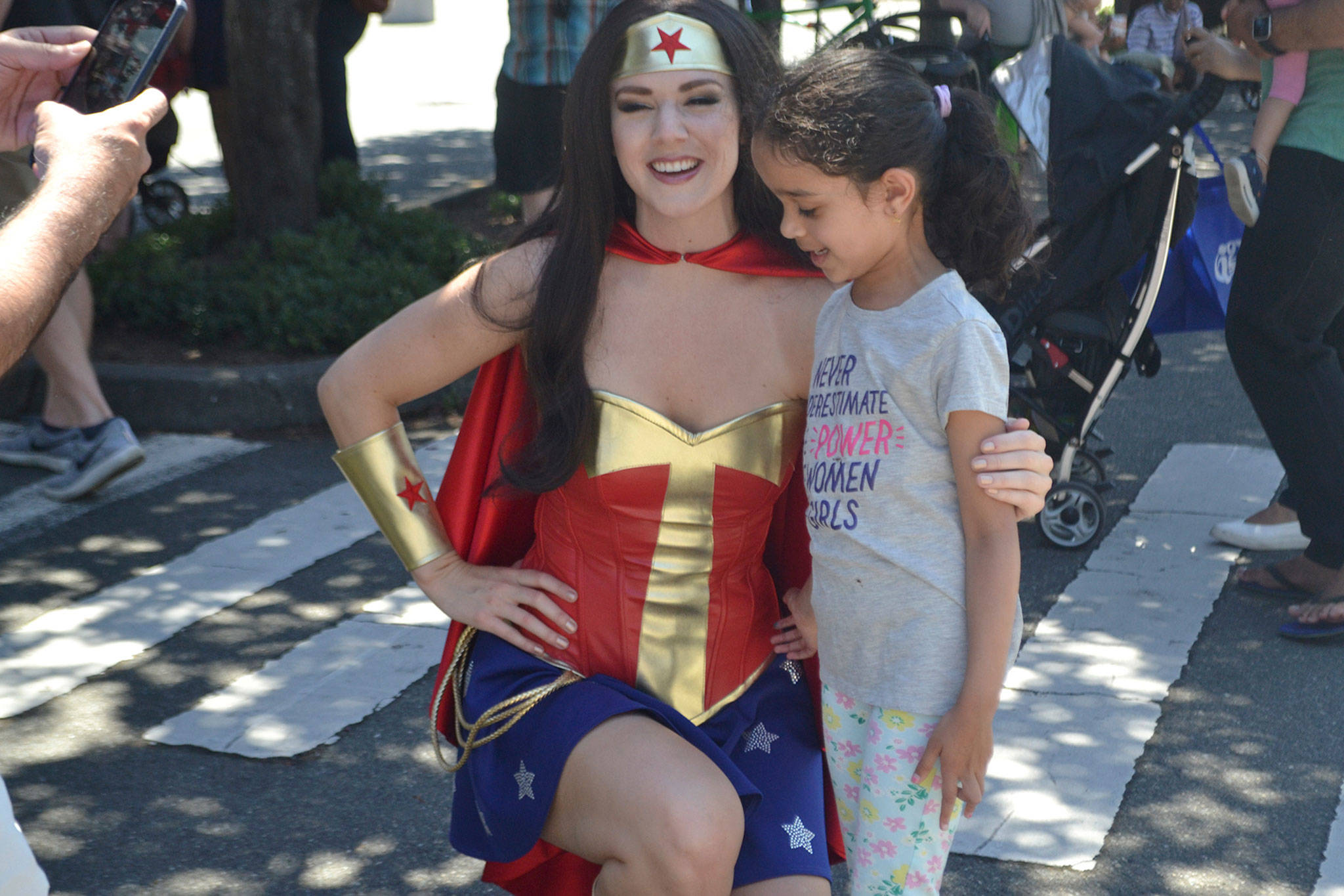 A young resident poses for a photo with Wonder Woman. Katie Metzger/staff photo