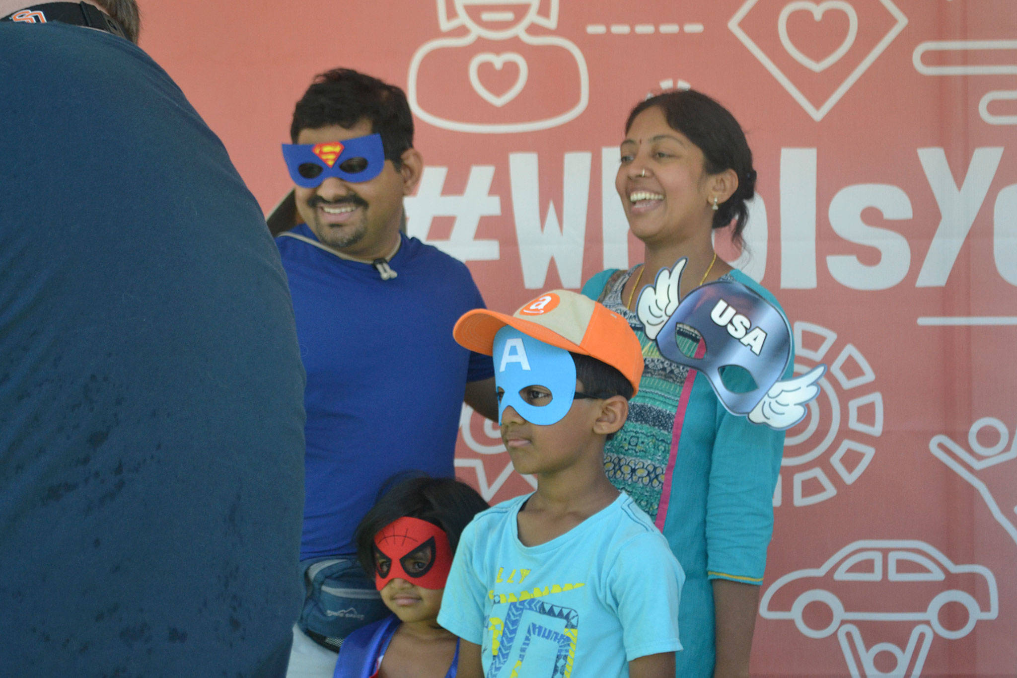 A family poses for a photo booth picture at Derby Days in Redmond. Katie Metzger/staff photo