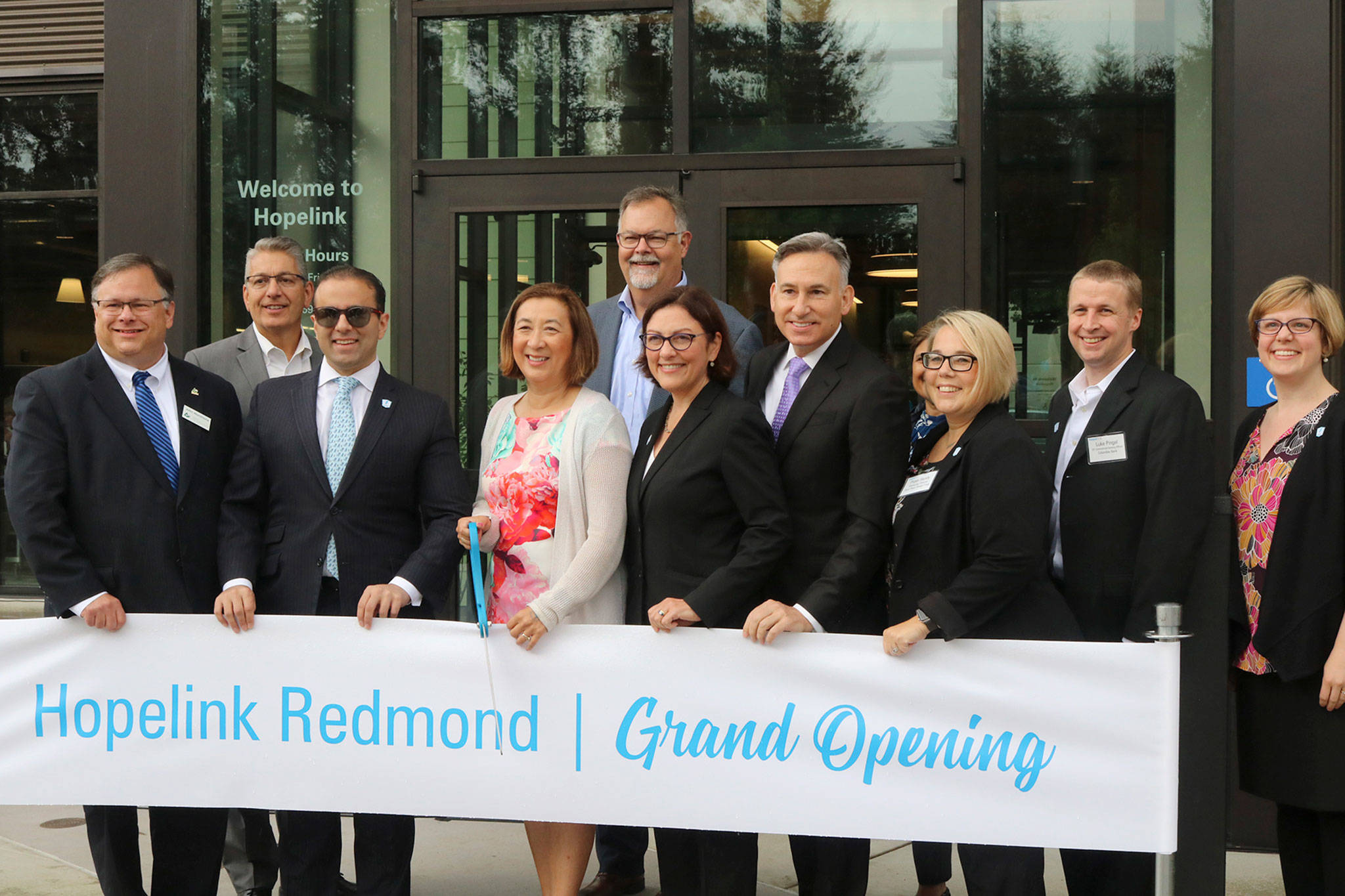 Hopelink CEO Lauren Thomas smiles with project partners and elected officials at the grand opening of the nonprofit’s new flagship facility in Redmond. Katie Metzger/staff photo