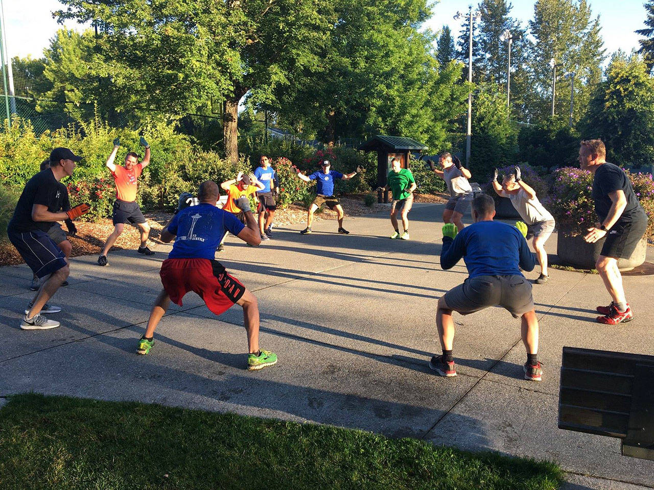 F3 members perform “Leprechaun in the Woods”, also known as squat jumping jack, as they wait for another group to return from a lap around the parking lot. Photo Courtesy of Brian “Dilfer” Gawthrop