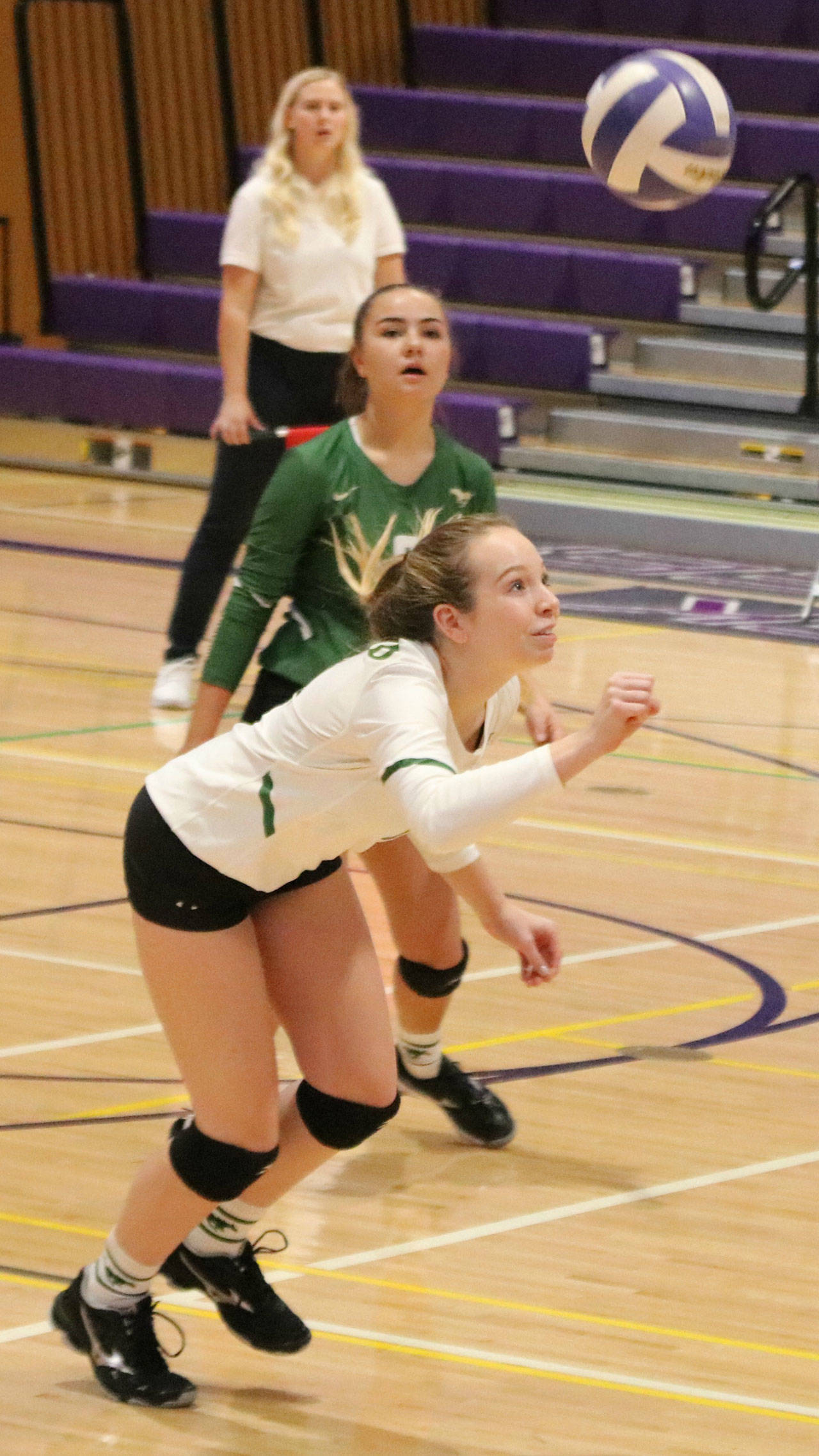 On the ball: Redmond High’s Megan Golembeski, front, and Mari Torgerson, back, during their Oct. 25 match. Andy Nystrom / staff photo