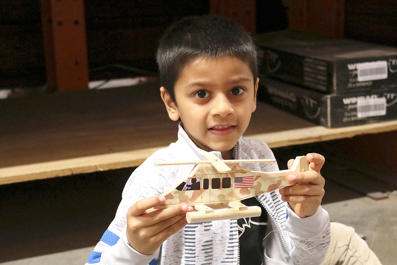 Aadi Panchal, 7 said his favorite part of the workshop was putting stickers on his helicopter. Stephanie Quiroz/staff photo.