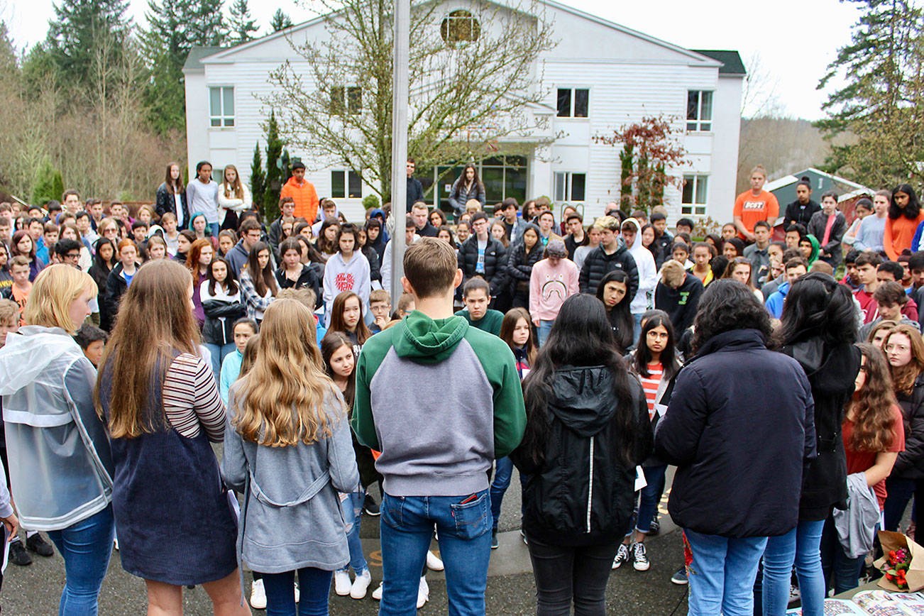 Overlake students participate in a walkout at the Redmond school on Wednesday morning calling on legislators and Congress to enact “common sense” gun control laws. The nationwide school walkouts were sparked by the Parkland, Florida, school shooting in which 17 students and teachers were killed on Feb. 14, a month from the date of the walkouts. Photo courtesy of Susan Messier/The Overlake School