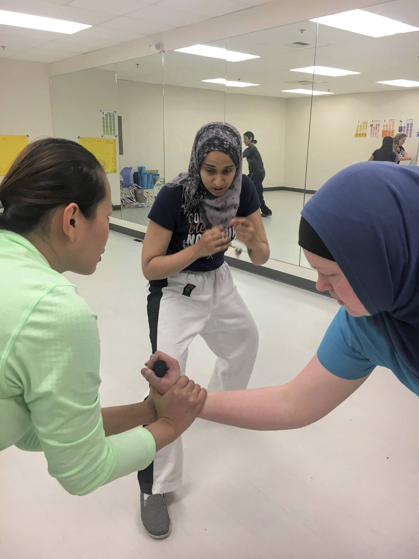Fauzia Lala works with some of her Level Four students at a class in Redmond on Jan. 15. Katie Metzger/staff photo