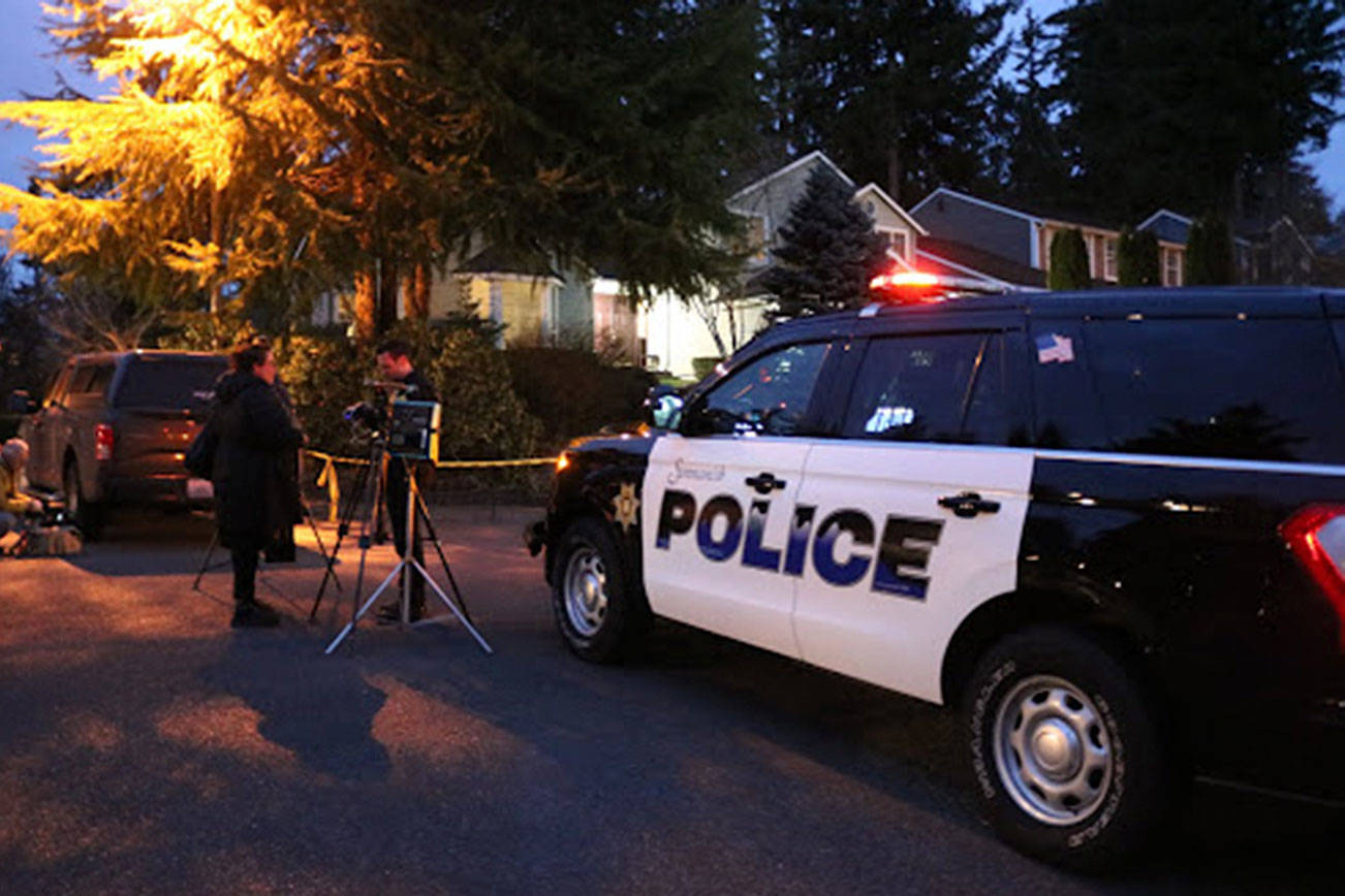 Authorities outside of the Klahanie home on Tuesday. Stephanie Quiroz/staff photo