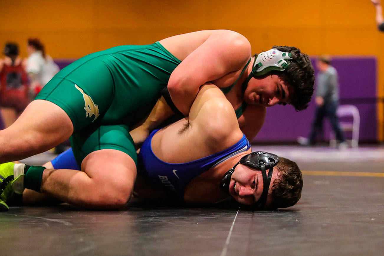 Redmond Mustangs 220-pound wrestler Alex Folta pinned Bothell’s Walker Hardan with just 32 seconds remaining in the third round of the 4A KingCo 220-pound title match on Feb. 2 at North Creek High School. Photo courtesy of Don Borin/Stop Action Photography