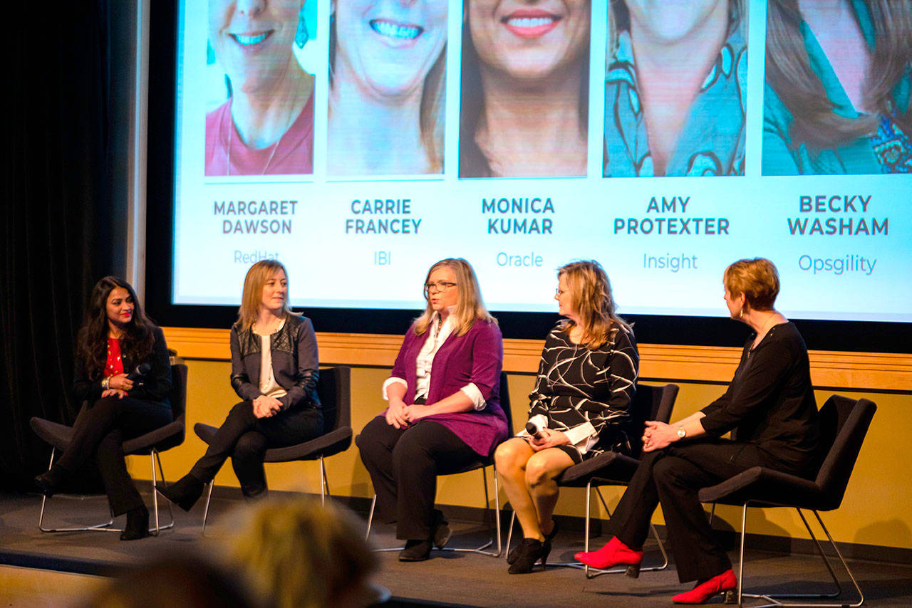 (Left to right) Monica Kumar, vice president of Oracle; Carrie Francey, vice president of Information Builders; Becky Washam, president and co-founder of Opsgility; Amy Protexter, senior vice president of North America marketing for Insight; and Margaret Dawson, vice president of Redhat speak at the Power Panel for Women in Cloud’s second annual summit. Courtesy of Vincent Konkel/Women in Cloud