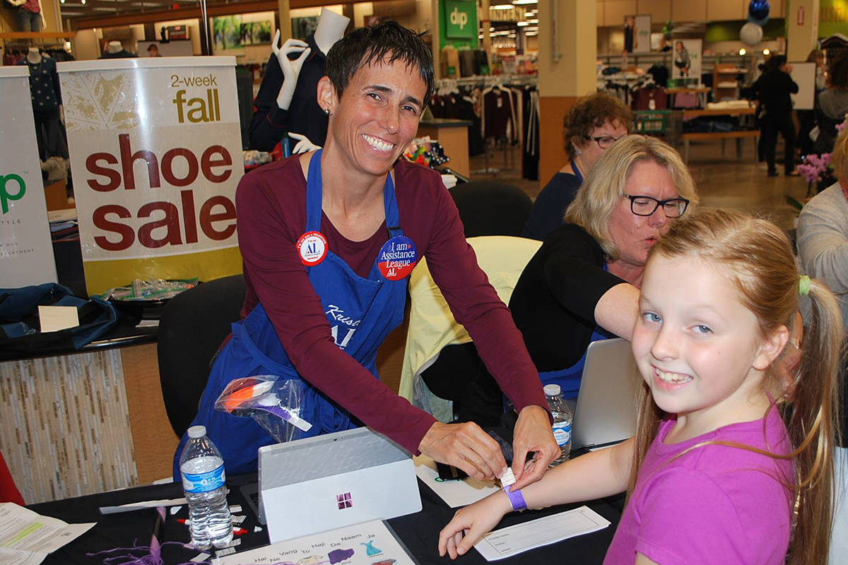 Assistance League of the Eastside volunteers raise more than $400,000 annually for Operation School Bell, which lets 3,500 local children select new back-to-school apparel at Fred Meyer shopping events.