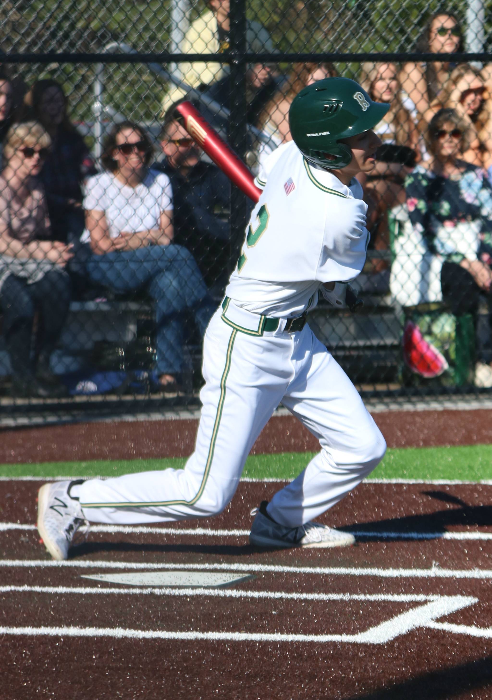 Redmond High’s Darek Khabani connects on a pitch. Andy Nystrom / staff photo