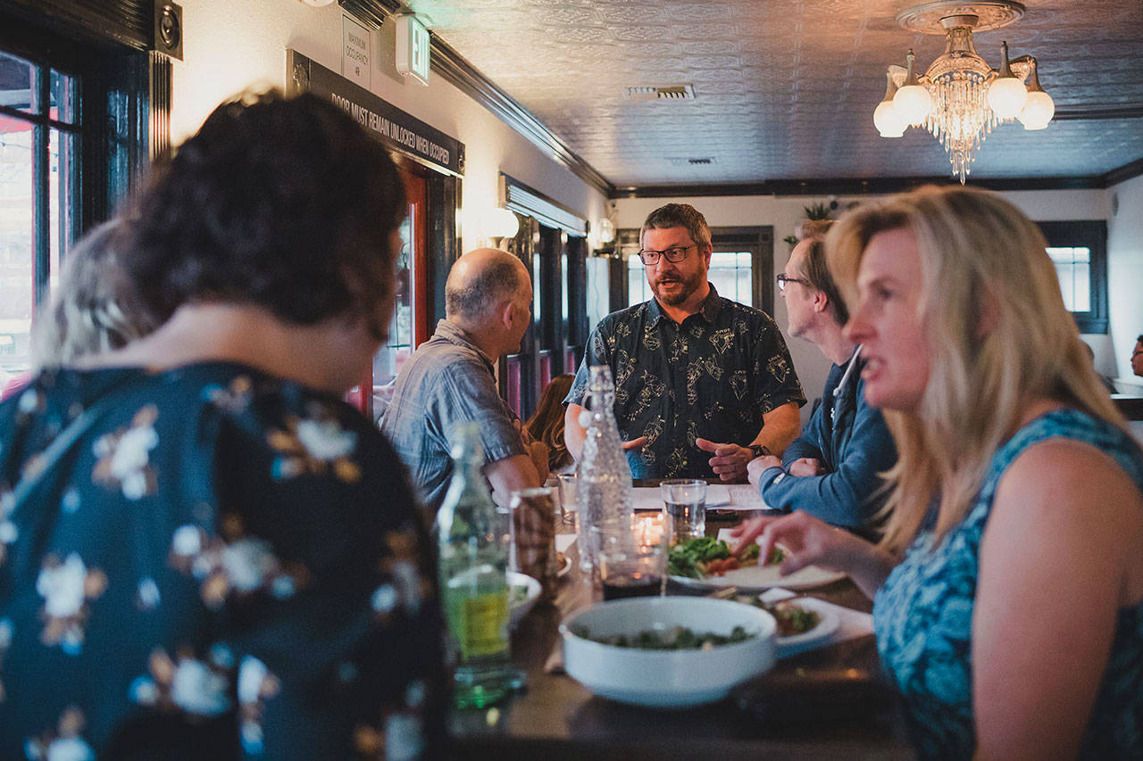 Tony Scott, co-owner of Woodblock and Spark Pizza, talks with customers as they dine. Tony hopes to preserve a community-focused hub with her restaurants and said he loves connecting with her patrons. Spark Pizza, Kelsey Corinne / courtesy photo