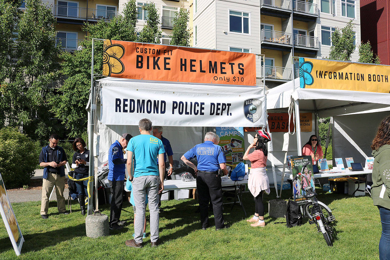 The Redmond Police Department selling helmets for adult and children at Bike Bash on May 17. Stephanie Quiroz/staff photo