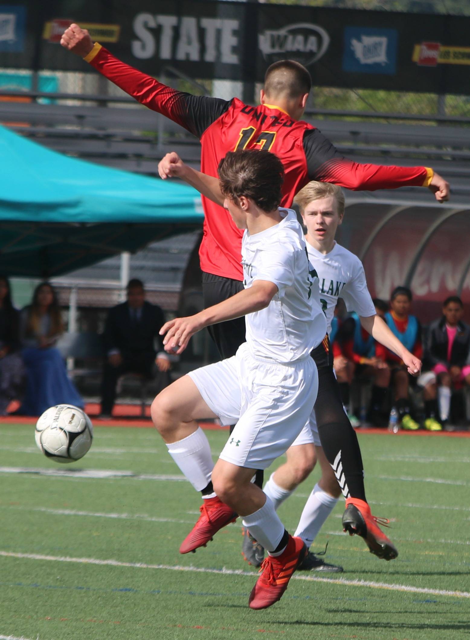 Overlake players battle for the ball in the semifinals. Andy Nystrom/ staff photo