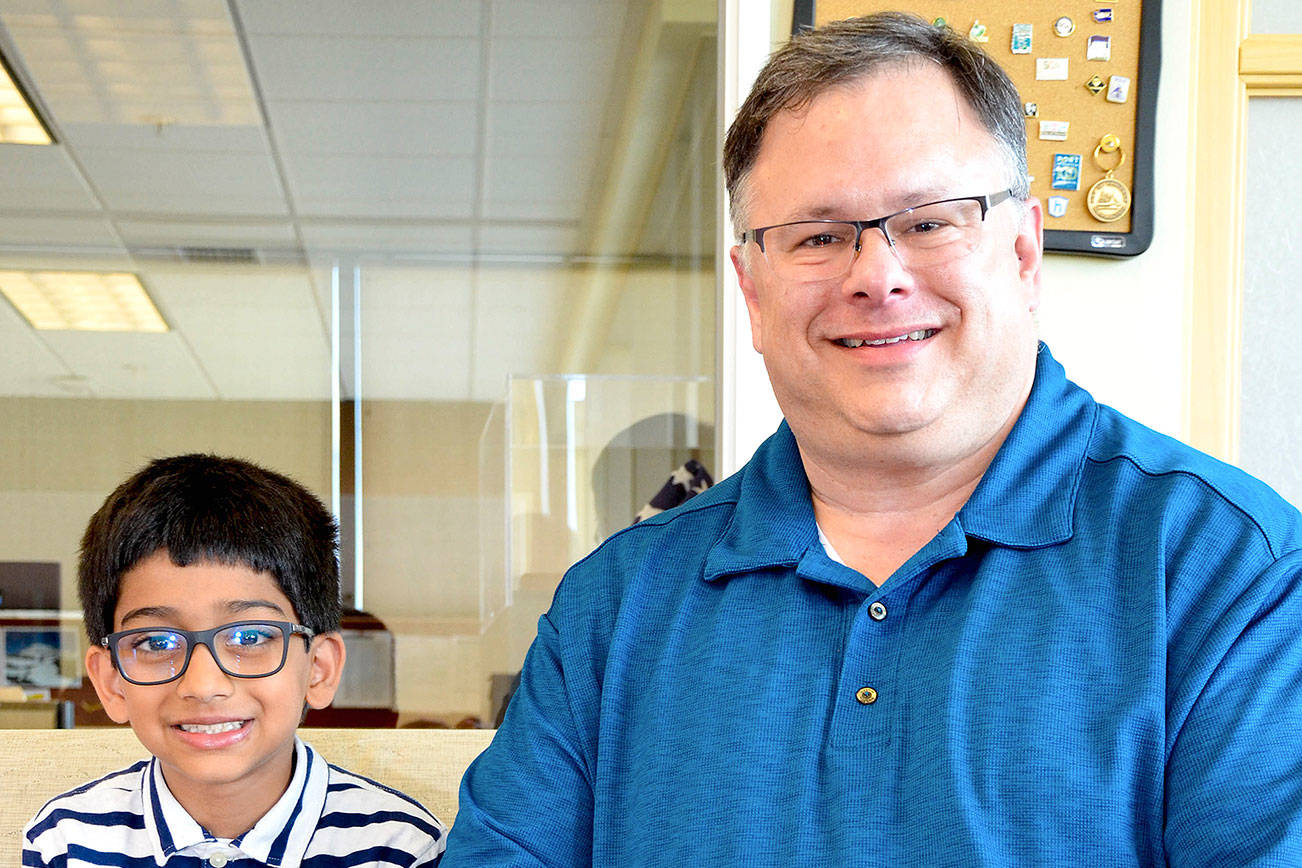 Photo courtesy of the city of Redmond                                 Siddhant Singh, 8, meets Mayor John Marchione to talk about his Beyblade tournament idea.