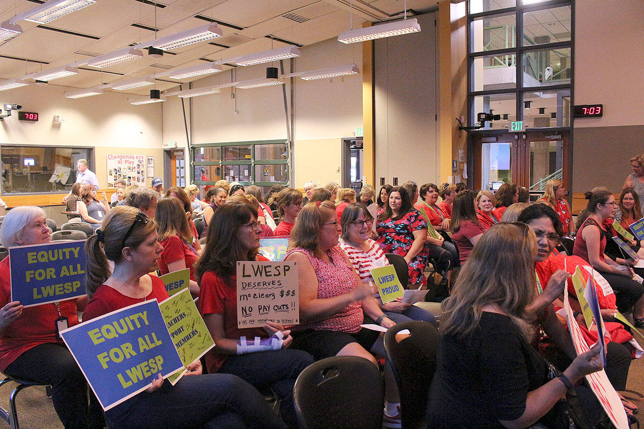 About 50 LWEA and LWESP members gather to support LWESP at Monday’s school board meeting. Madison Miller/staff photo