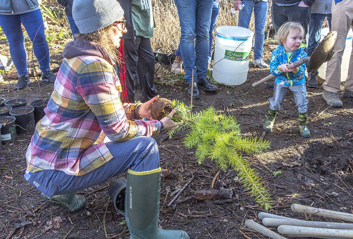 “My job is awesome because I get to spend so much time outside. Here, I’m planting a tree at a community event that I helped organize,” Sophia says.