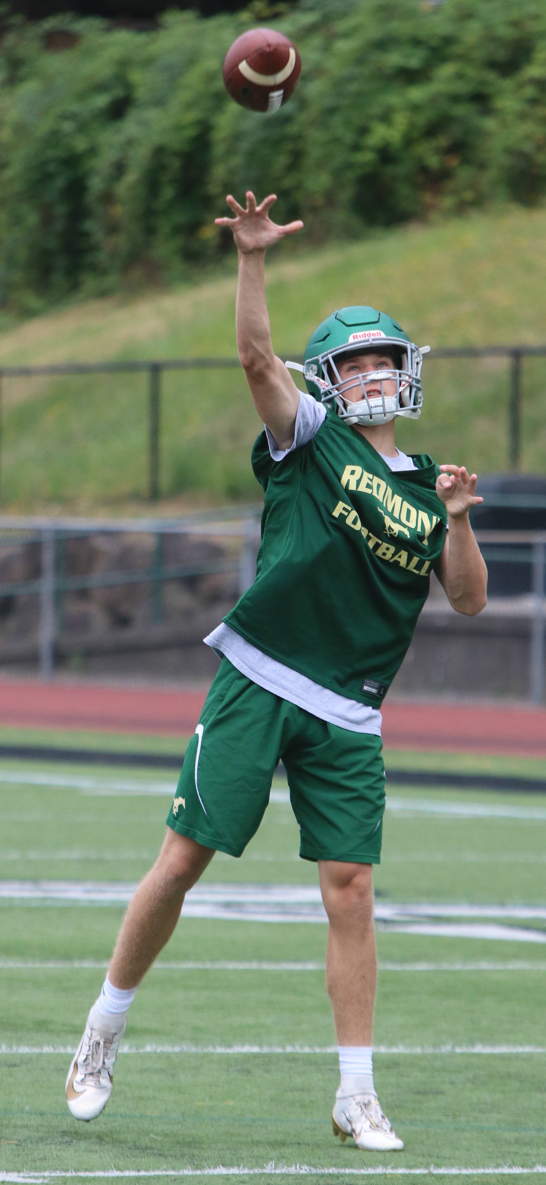 Redmond High starting quarterback Tyler Fortney gets in some throwing at practice. Andy Nystrom/ staff photo