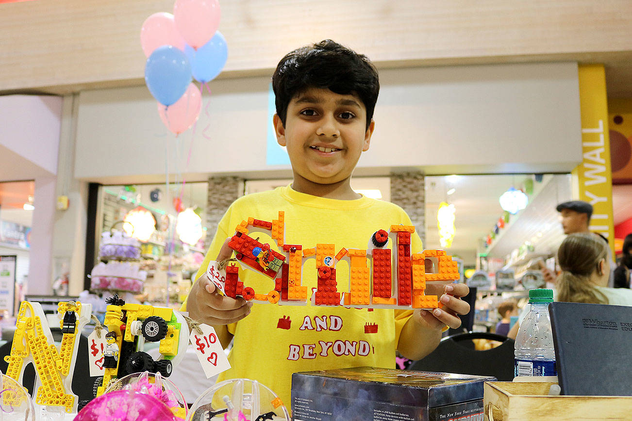 Stephanie Quiroz/staff photo                                 Rayed Siddiqui, 9, from Redmond sold handmade lego structures at the business fair on Aug. 26.