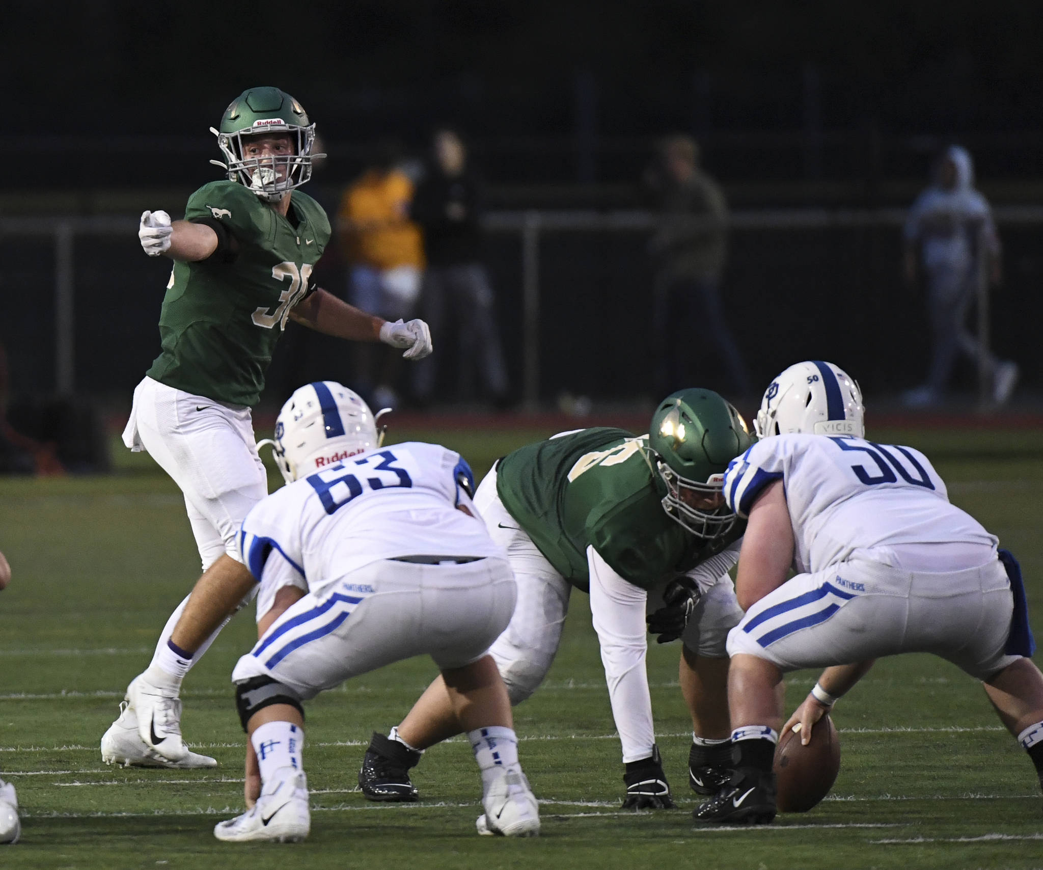 Braydon Bruener, linebacker and running back, makes defensive adjustments in a 24-17 loss to Seattle Prep on Friday, Sept. 13. Photo courtesy of Matt Campbell Photography