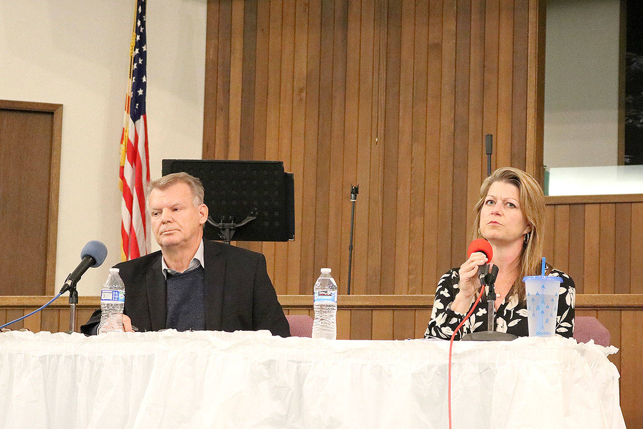 Steve Fields and Angela Birney answer questions at the candidate forum hosted by Education Hill Neighborhood Association (EdHNA) at First Baptist Church on Oct. 3. Stephanie Quiroz/staff photo