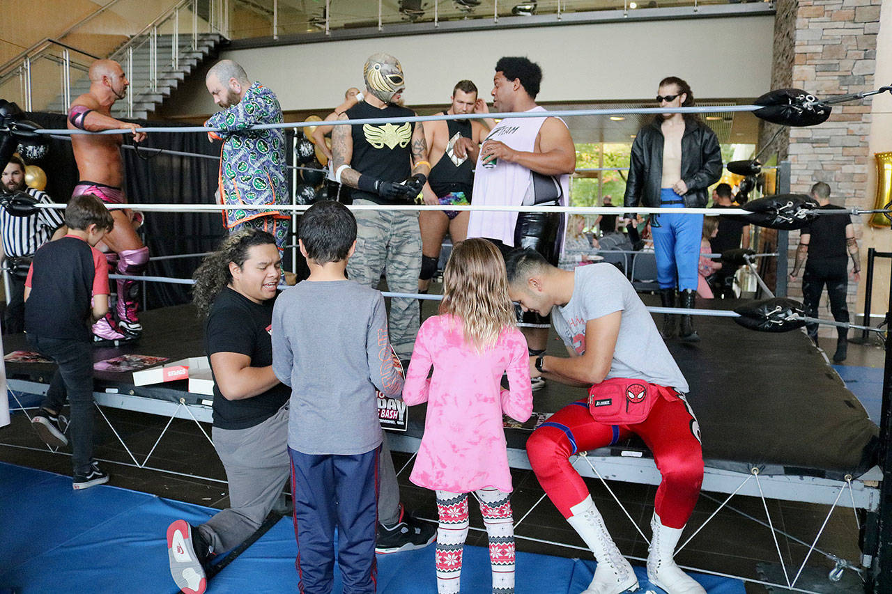 Stephanie Quiroz/staff photos                                 The wrestlers signed autographs at Max’s tenth birthday wrestling bash.