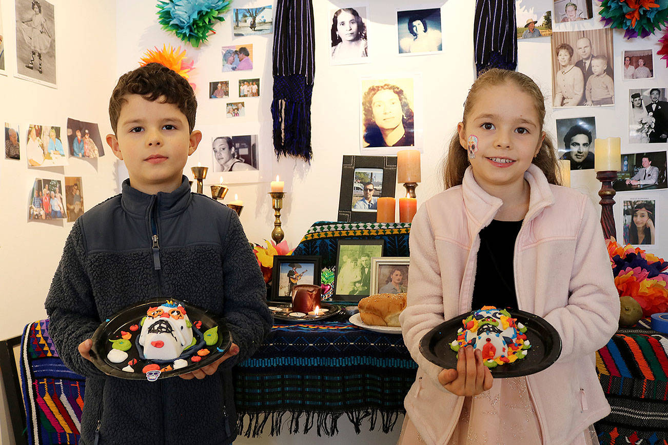 Alejandro, 6, and Elizabeth, 8, Camacho from Woodinville with their sugar skulls at the Día de los Muertos event on Nov. 2 at the Centro Cultural Mexicano in Redmond. Stephanie Quiroz/staff photo