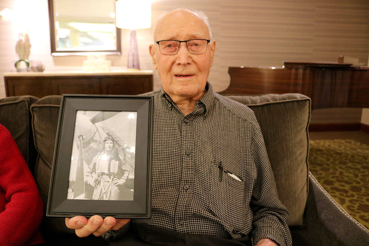 Stephanie Quiroz/staff photo                                 Morten Joslin, 95, holds a picture of himself during WWII.