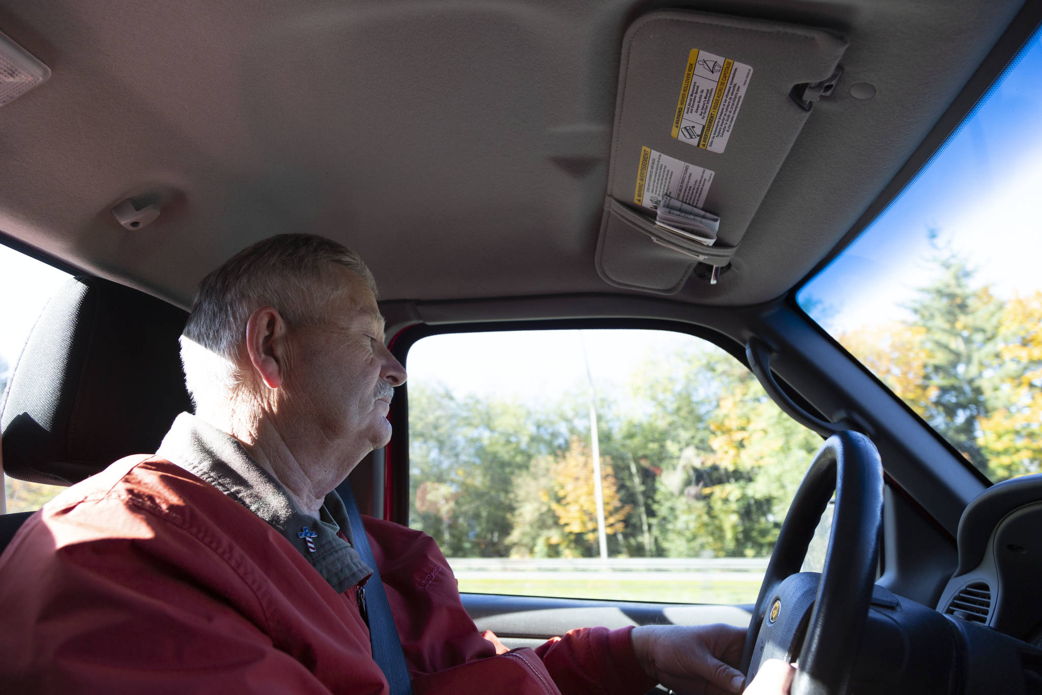 On a foggy October morning, Curtis drives south toward the Tacoma area. He had his flyers in hand, and raffle tickets to sell. They would benefit the family of Andrew Yoder, a Marine Veteran who died in Seattle during the crane collapse this spring. Staff photo/Ashley Hiruko