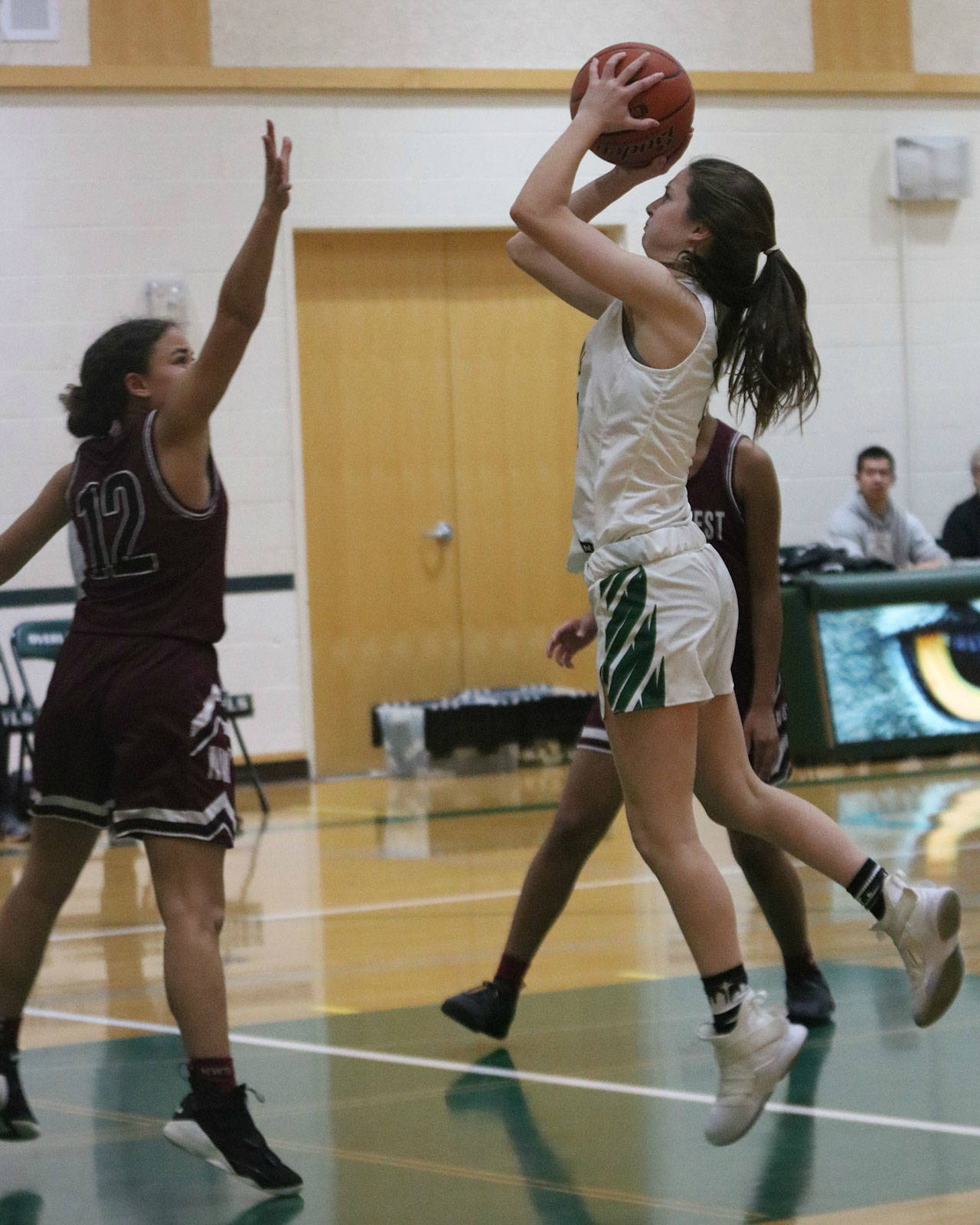 Owl sophomore Addie Sapirstein goes up for a shot against Northwest. Andy Nystrom/ staff photo