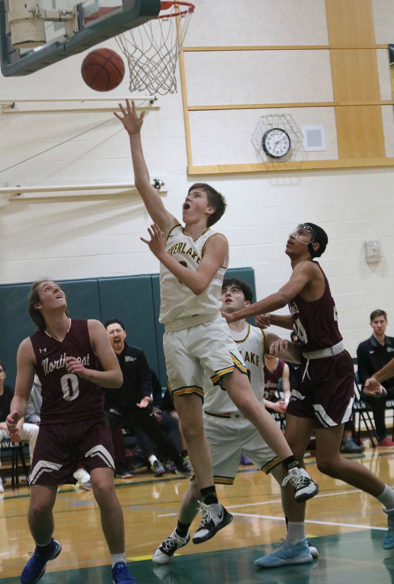 Overlake freshman Jake Shuey drives to the hoop against Northwest. Andy Nystrom/ staff photo