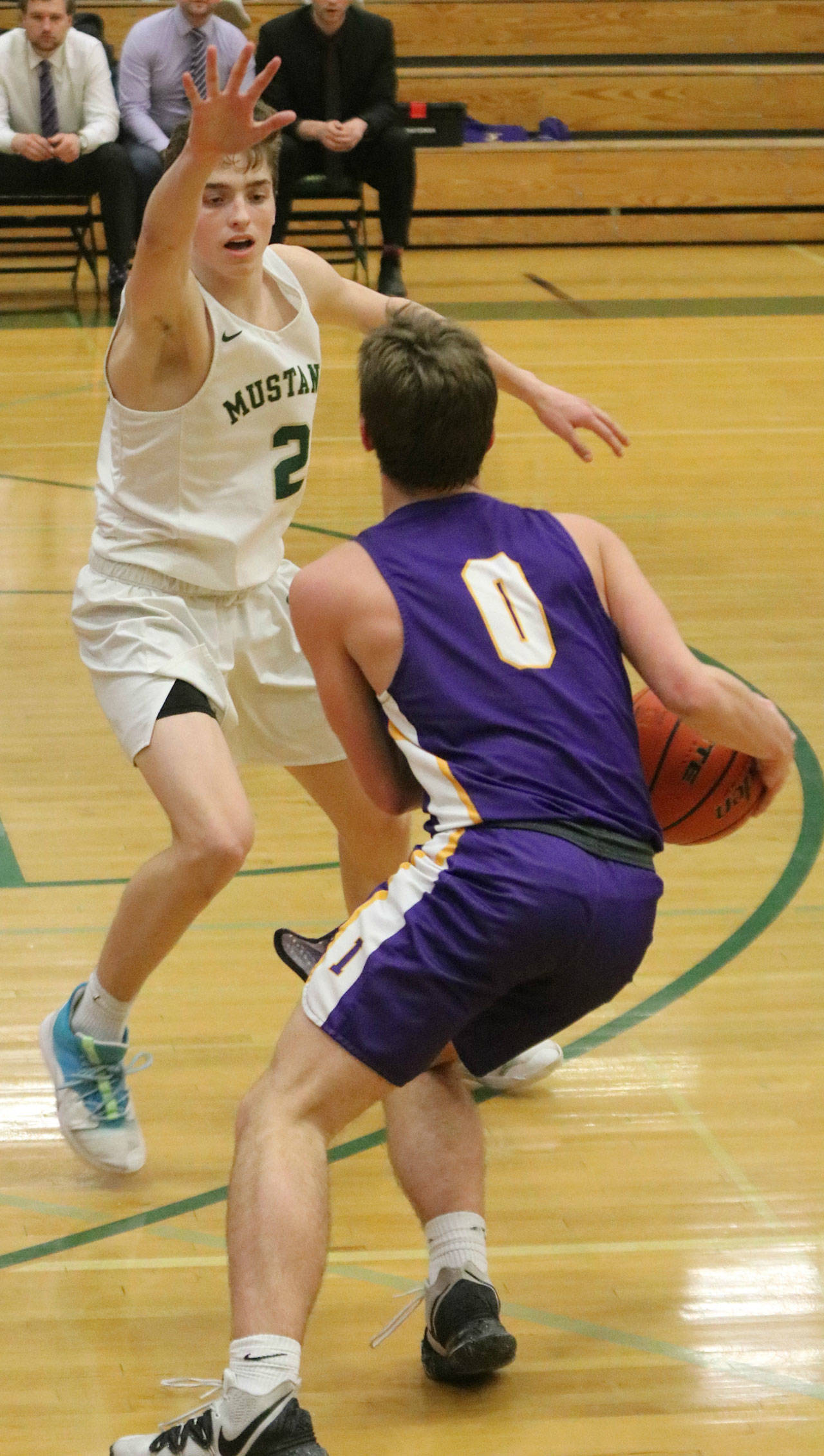 Redmond’s Nathan Miller defends Issaquah’s Tommy Reisner. Andy Nystrom/ staff photo